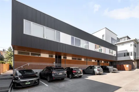 a view of a cars parked in front of a building