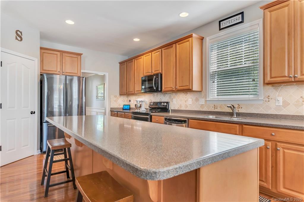 5303 Conant Circle Fort Mill, SC 29708 - Photo 11 of 37 a kitchen with stainless steel appliances granite countertop a sink refrigerator and microwave