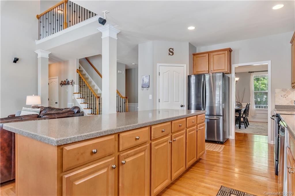 5303 Conant Circle Fort Mill, SC 29708 - Photo 12 of 37 a kitchen with stainless steel appliances granite countertop a sink and a refrigerator