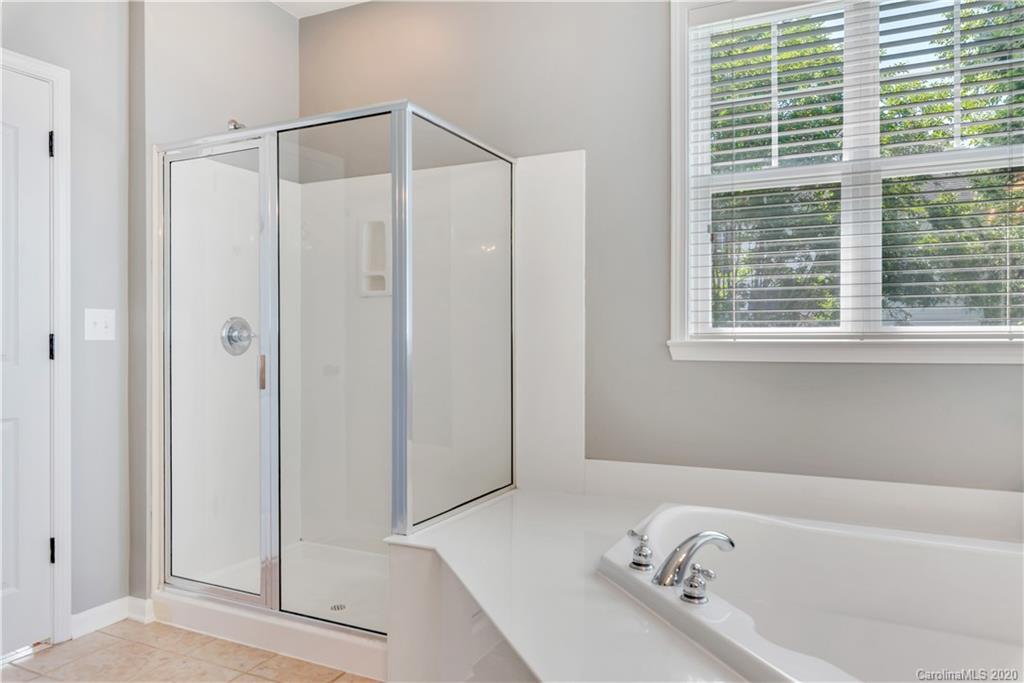 5303 Conant Circle Fort Mill, SC 29708 - Photo 17 of 37 a bathroom with a bathtub and a shower