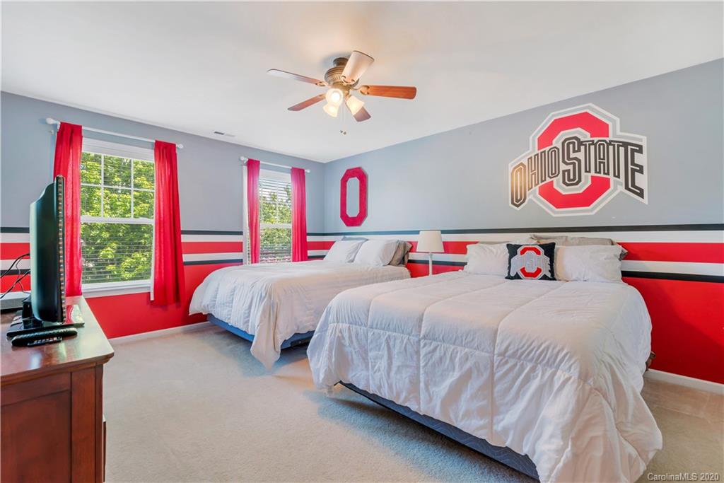 5303 Conant Circle Fort Mill, SC 29708 - Photo 24 of 37 a bedroom with a bed and a white couch