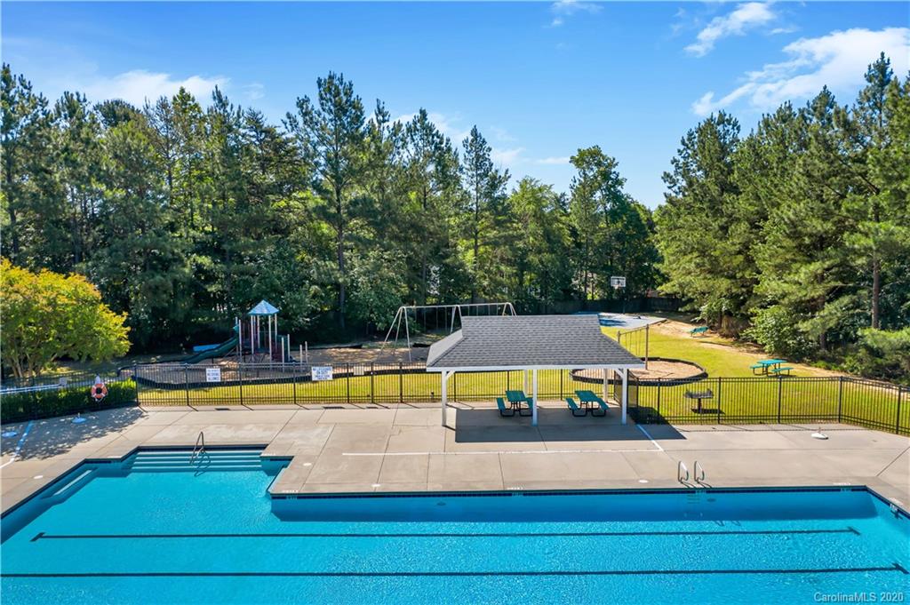 5303 Conant Circle Fort Mill, SC 29708 - Photo 36 of 37 a view of a swimming pool with an outdoor space and seating area