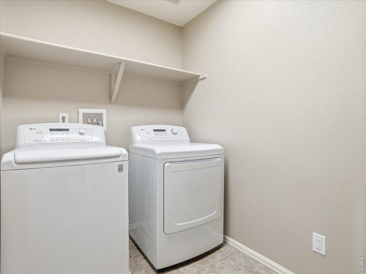 1565 Basildon Court Windsor, CO 80550 - Photo 23 of 36 a utility room with dryer and washer
