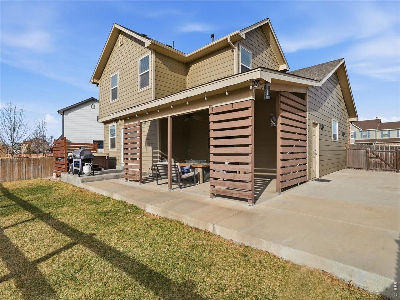 1565 Basildon Court Windsor, CO 80550 - Photo 25 of 36 a view of a house with backyard and porch