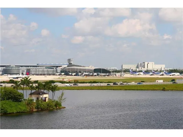 a view of swimming pool with outdoor seating and yard in back
