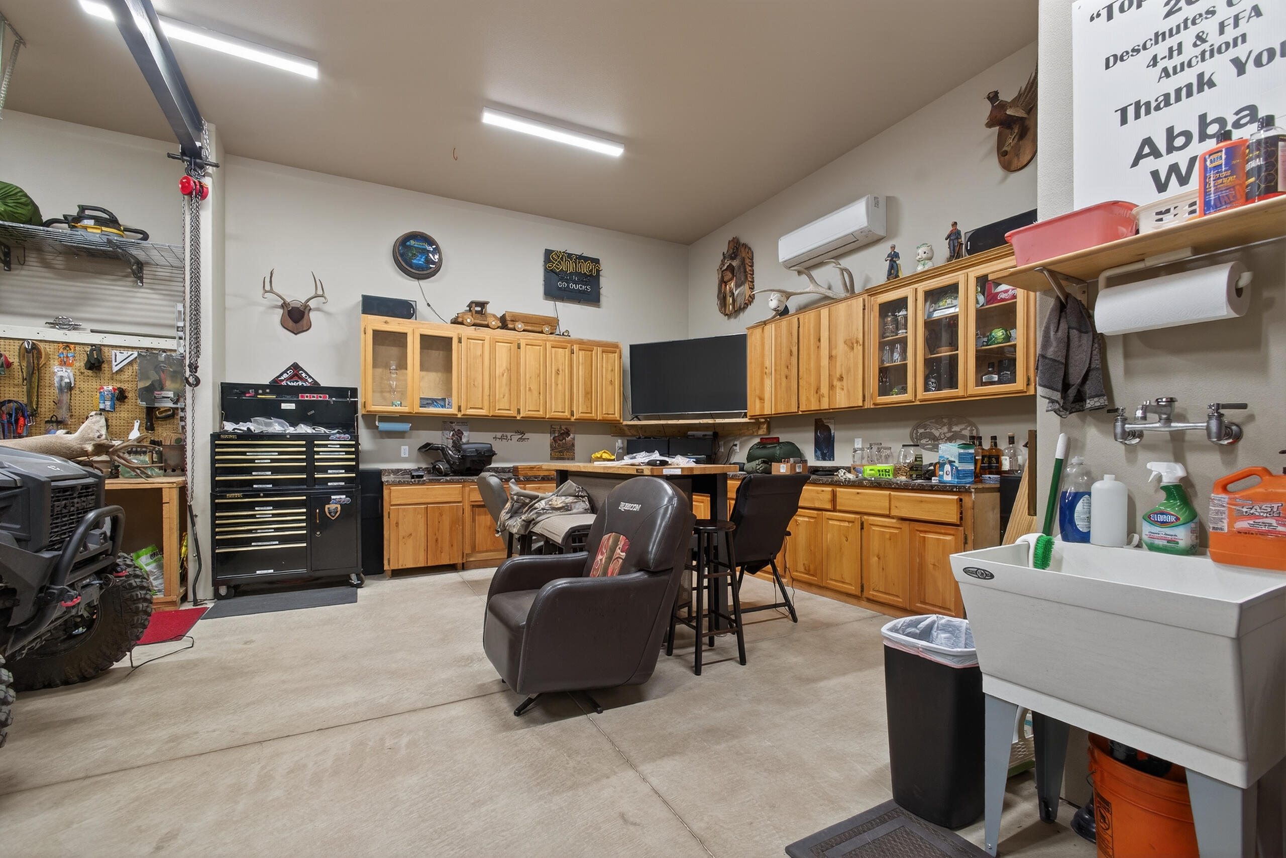 2793 Southwest 33rd Street Redmond, OR 97756 - Photo 35 of 44 a living room with furniture and a flat screen tv