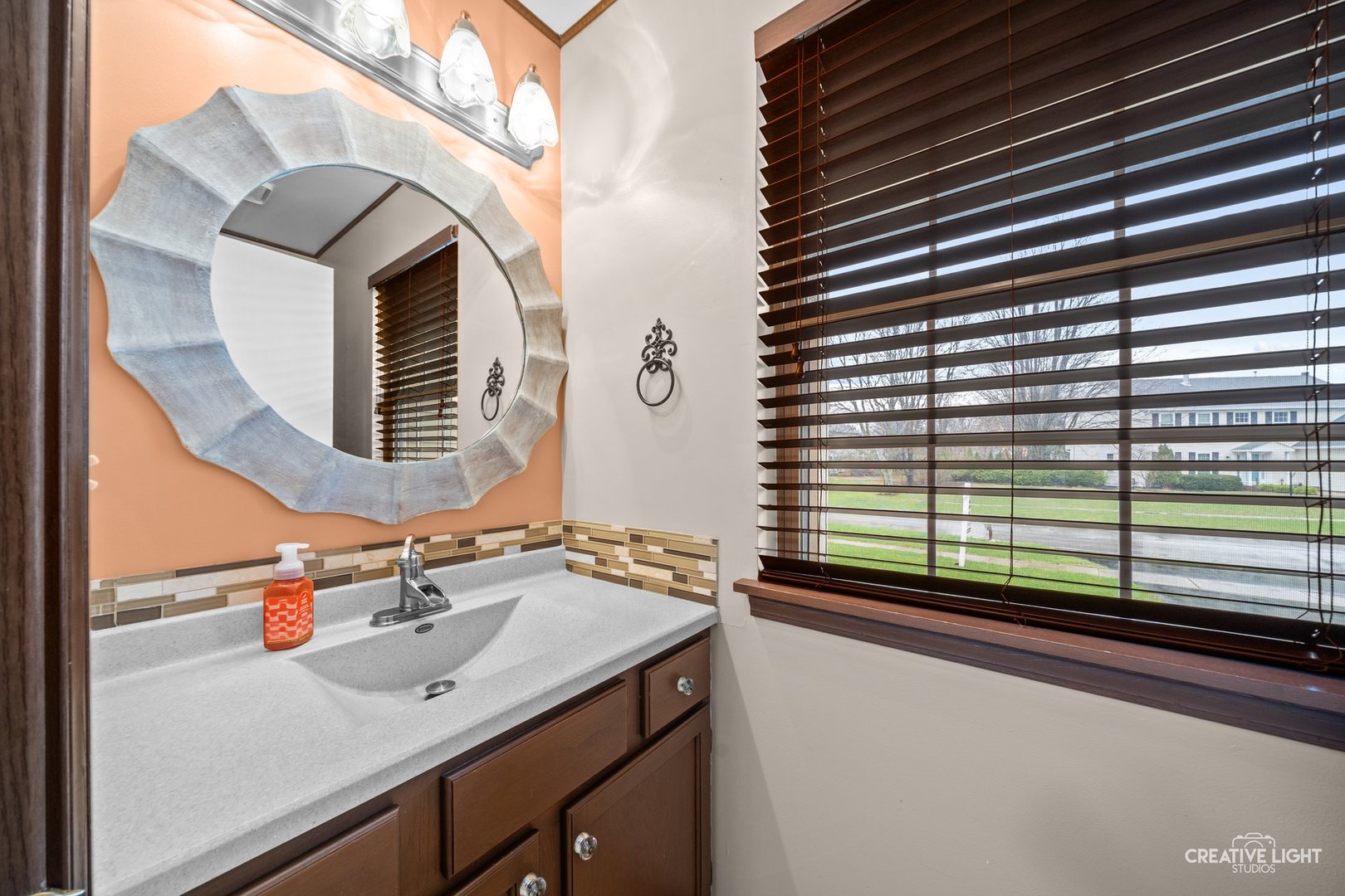 722 Burton Drive Batavia, IL 60510 - Photo 13 of 35 a bathroom with a sink and a mirror
