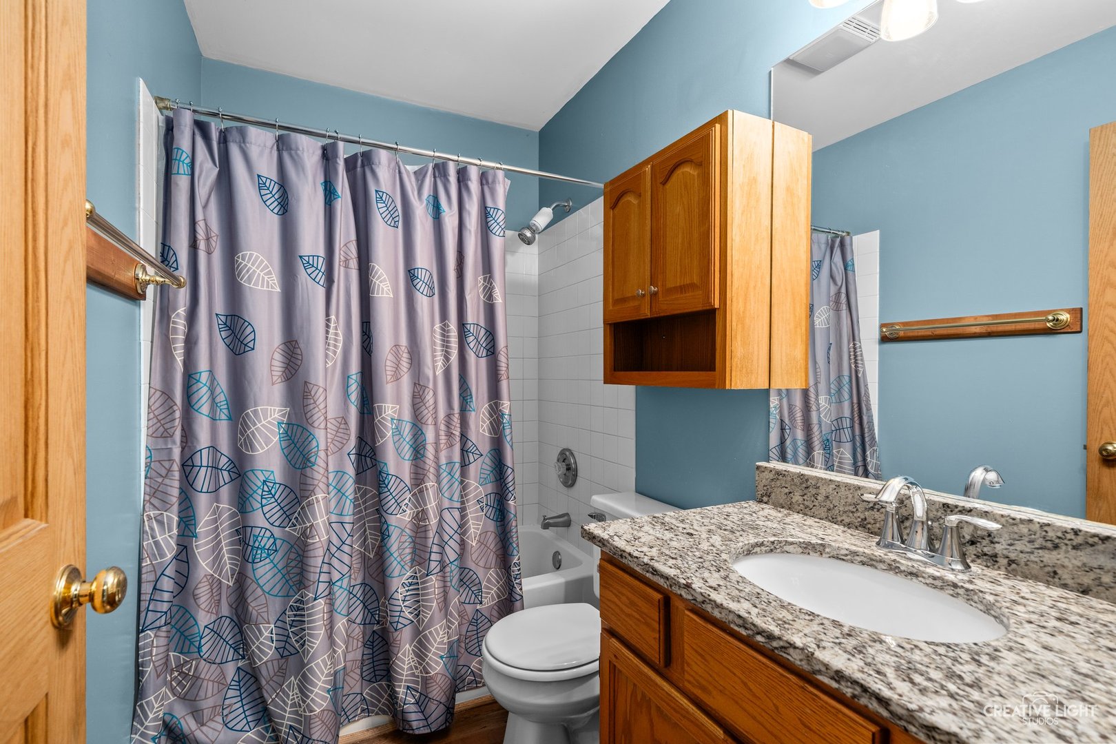 722 Burton Drive Batavia, IL 60510 - Photo 17 of 35 a bathroom with a granite countertop sink toilet and mirror