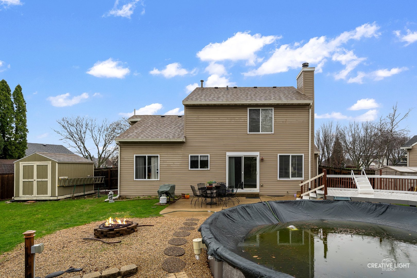 722 Burton Drive Batavia, IL 60510 - Photo 26 of 35 a view of a house with swimming pool and a yard