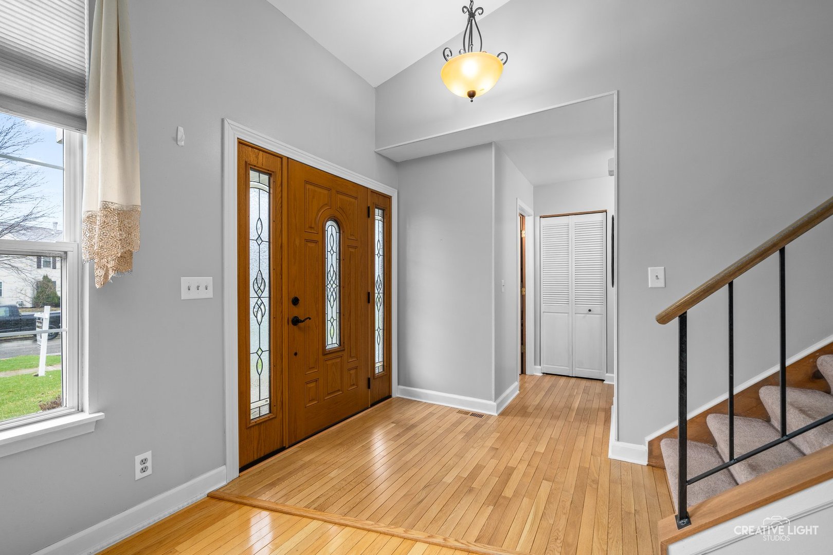 722 Burton Drive Batavia, IL 60510 - Photo 3 of 35 a view of an entryway with wooden floor and door