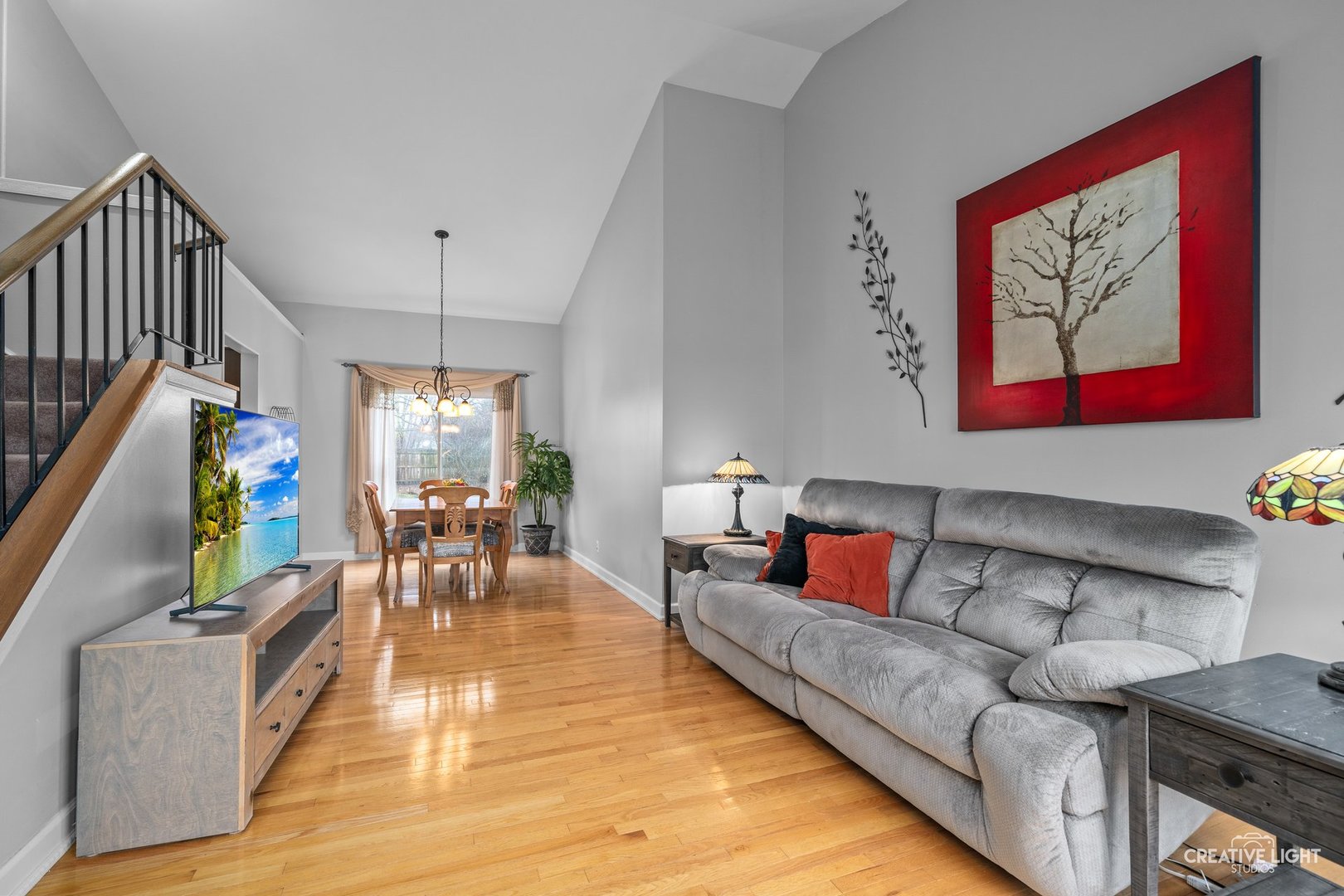 722 Burton Drive Batavia, IL 60510 - Photo 4 of 35 a living room with furniture and a flat screen tv
