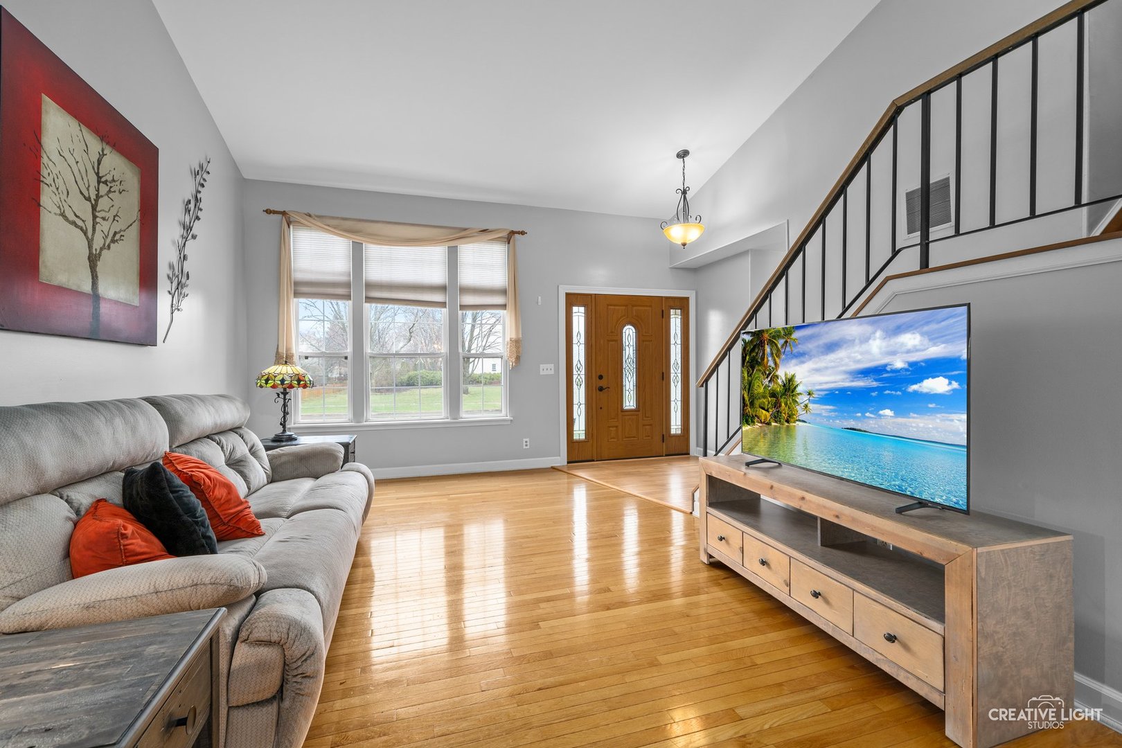 722 Burton Drive Batavia, IL 60510 - Photo 6 of 35 a living room with furniture and a flat screen tv