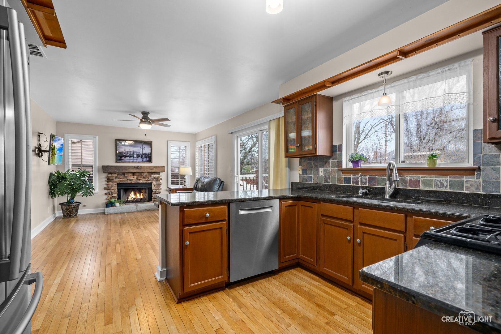 722 Burton Drive Batavia, IL 60510 - Photo 8 of 35 a kitchen with stainless steel appliances granite countertop sink stove top oven and cabinets