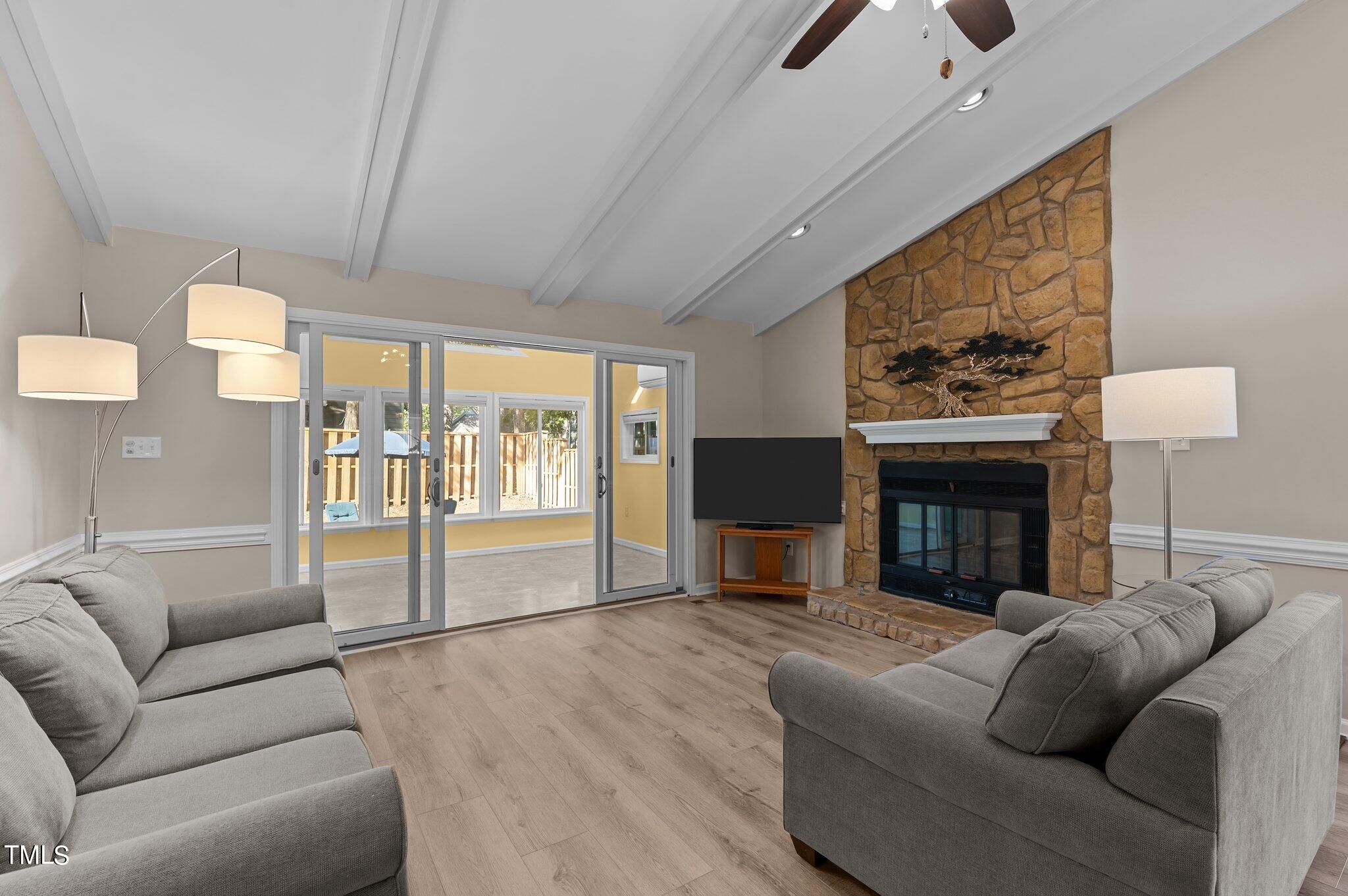 1503 Nature Court Raleigh, NC 27609 - Photo 10 of 36 a living room with furniture and a fireplace