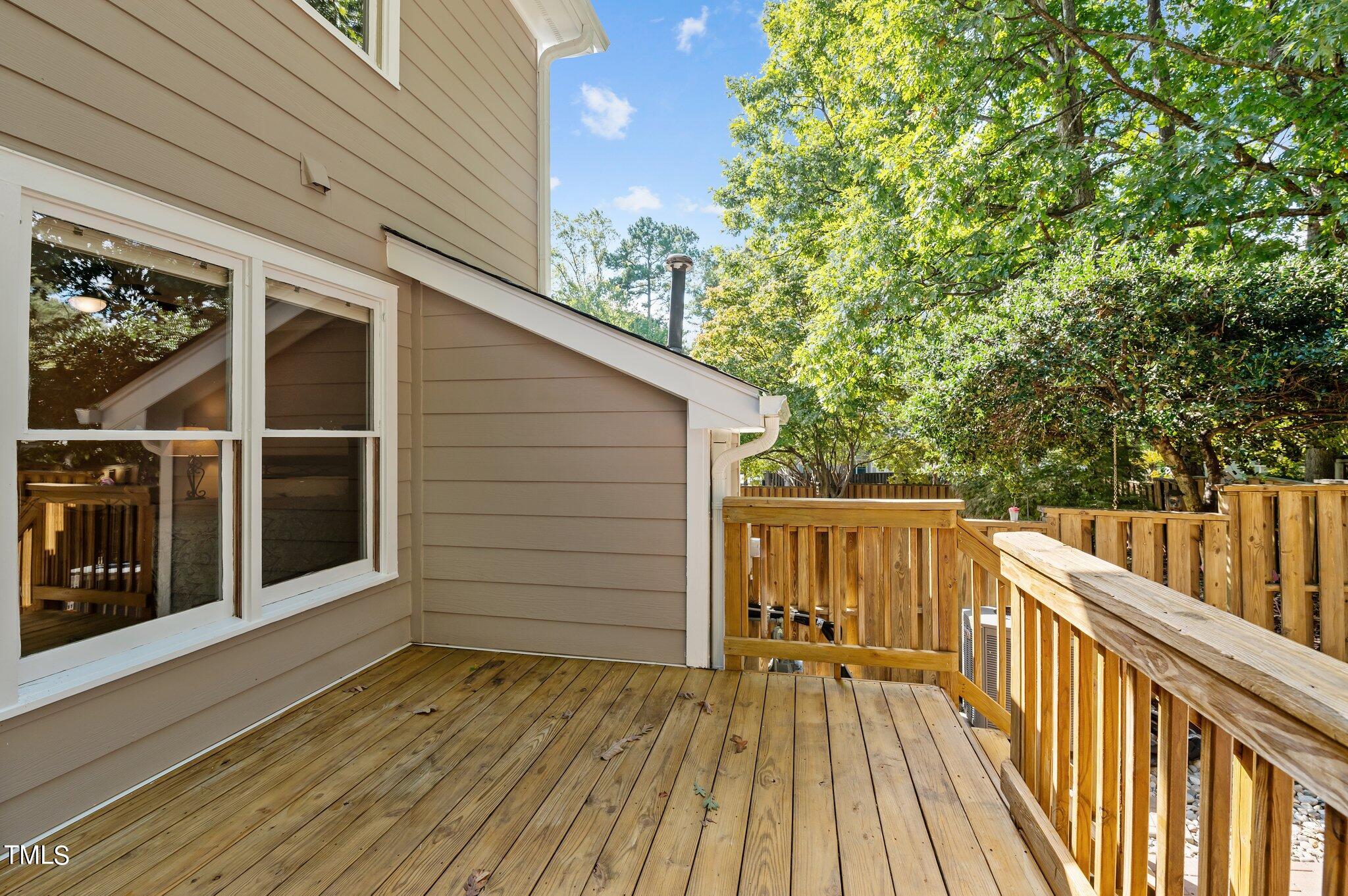 1503 Nature Court Raleigh, NC 27609 - Photo 16 of 36 a view of deck with wooden floor and fence