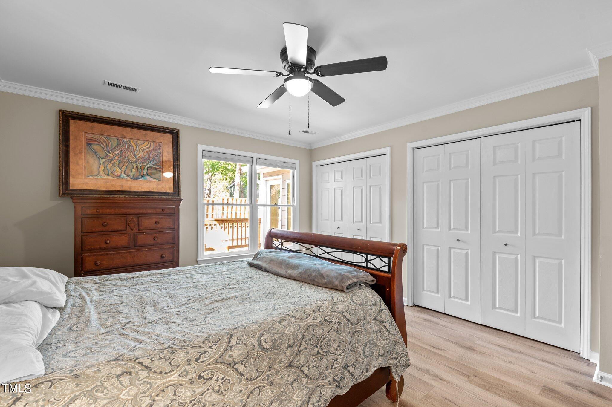 1503 Nature Court Raleigh, NC 27609 - Photo 22 of 36 a bedroom with a bed and a window