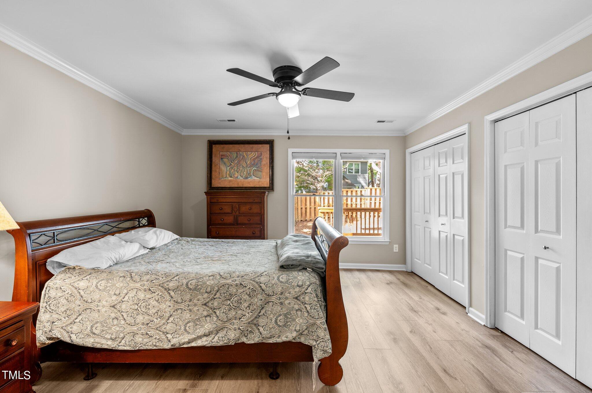 1503 Nature Court Raleigh, NC 27609 - Photo 23 of 36 a bedroom with a bed and a window
