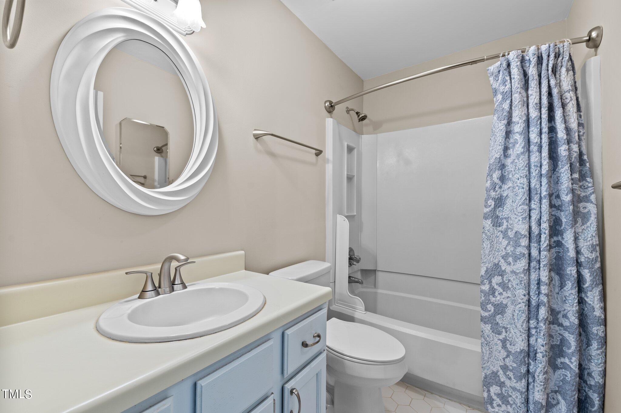1503 Nature Court Raleigh, NC 27609 - Photo 28 of 36 a bathroom with a sink toilet and shower