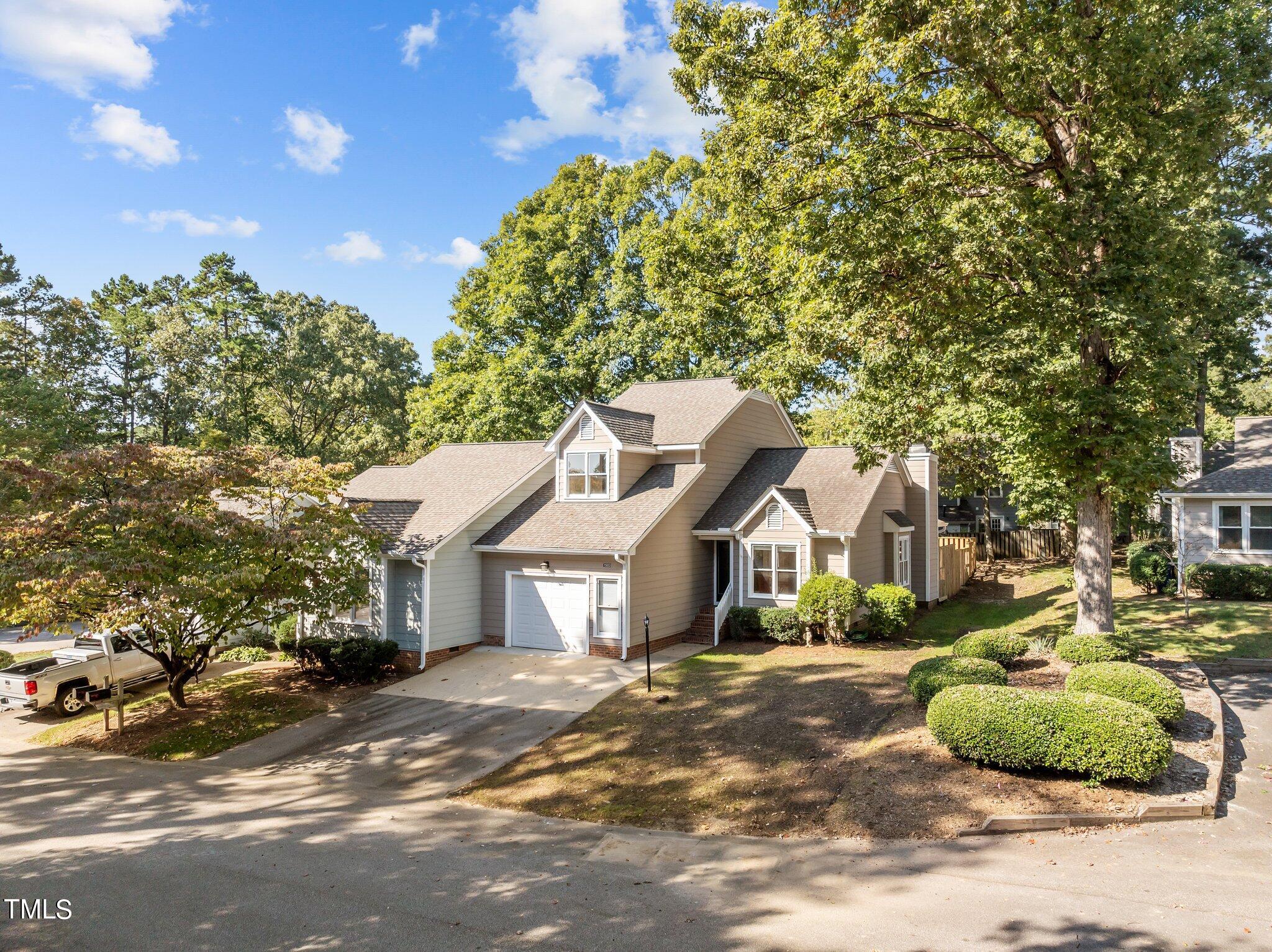 1503 Nature Court Raleigh, NC 27609 - Photo 2 of 36 a front view of a house with a yard and garage