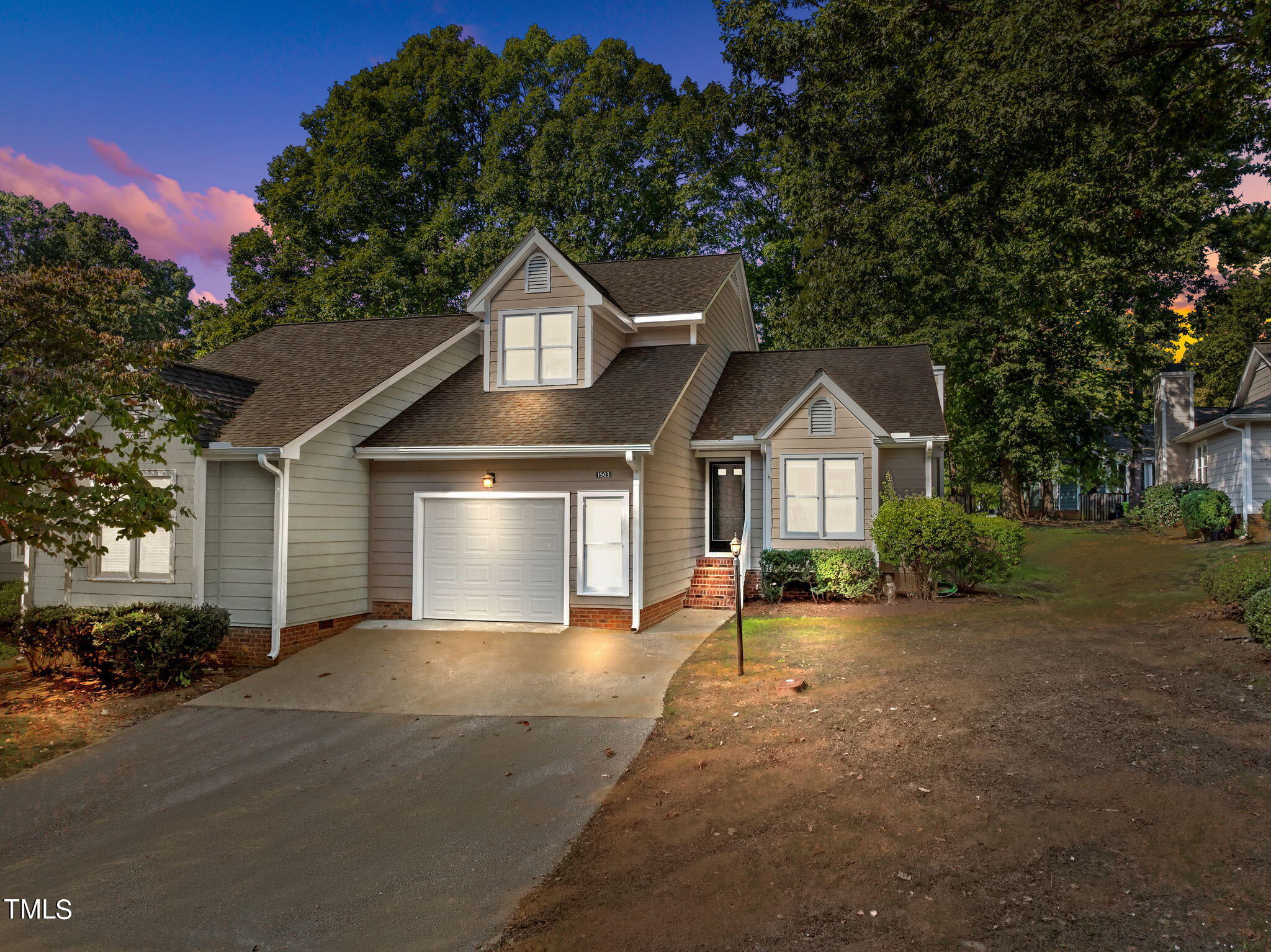 1503 Nature Court Raleigh, NC 27609 - Photo 32 of 36 a front view of a house with yard and parking