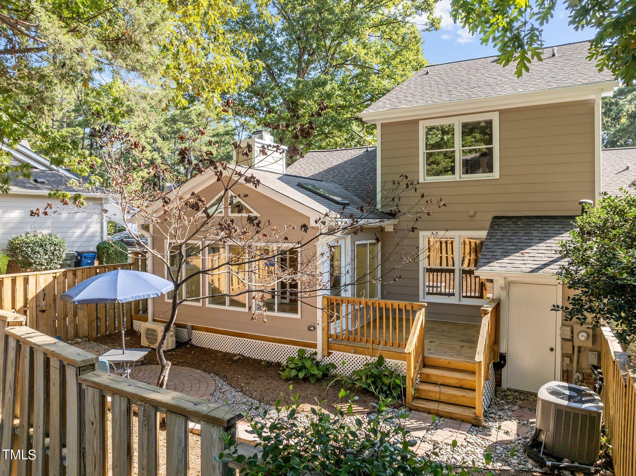 1503 Nature Court Raleigh, NC 27609 - Photo 3 of 36 a view of a house with backyard and sitting area