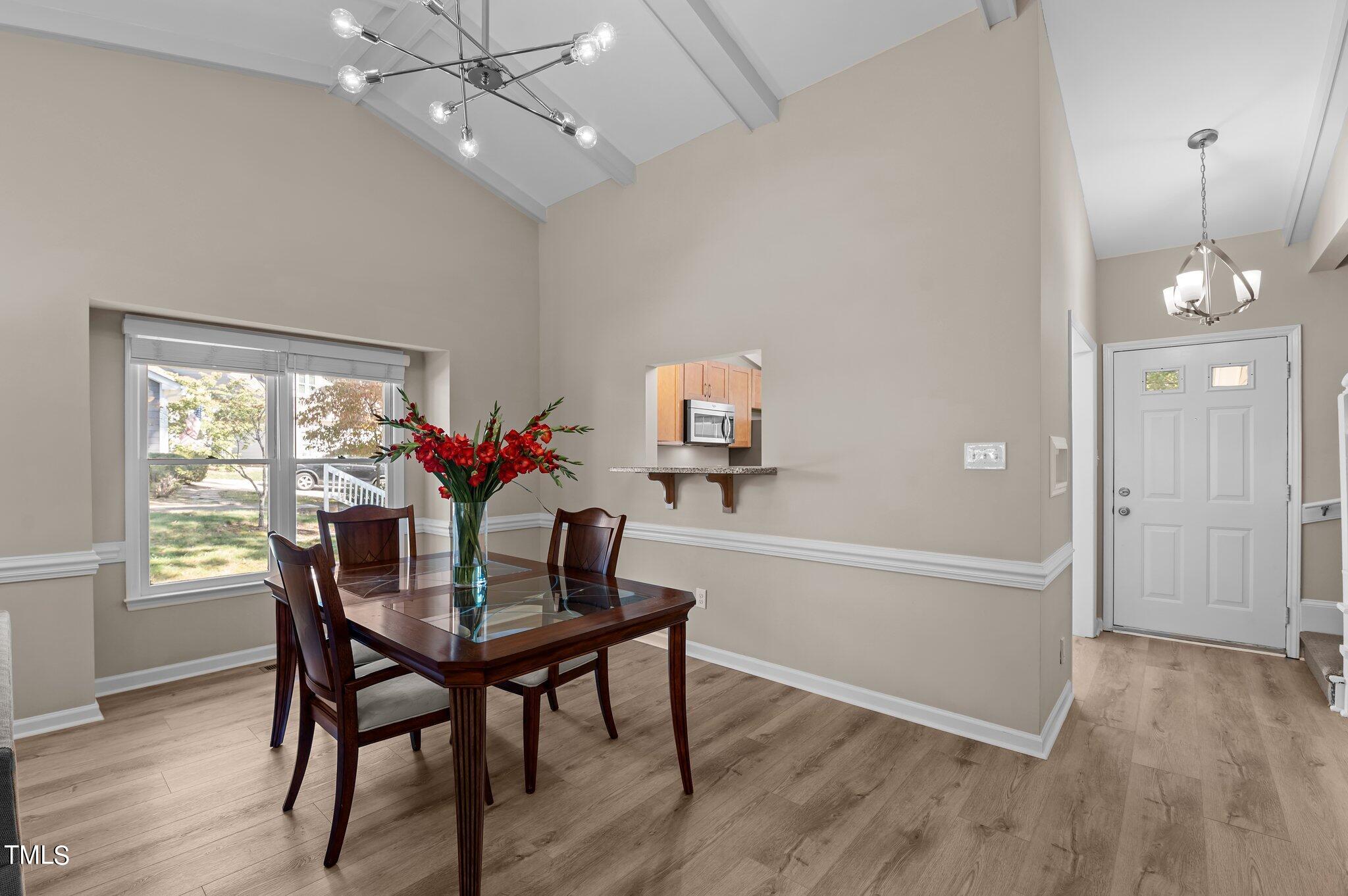 1503 Nature Court Raleigh, NC 27609 - Photo 8 of 36 a view of a dining room with furniture window and wooden floor