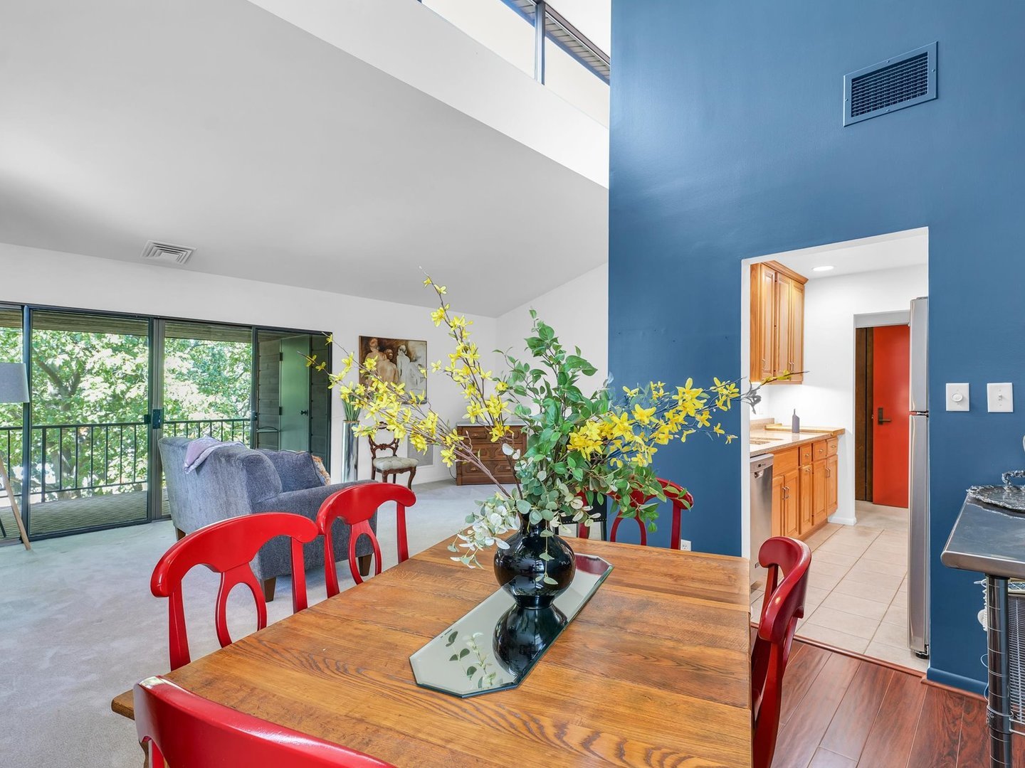 107 North Elm Street, Unit 310 Champaign, IL 61820 - Photo 11 of 34 a view of a dining room with furniture a potted plant and wooden floor