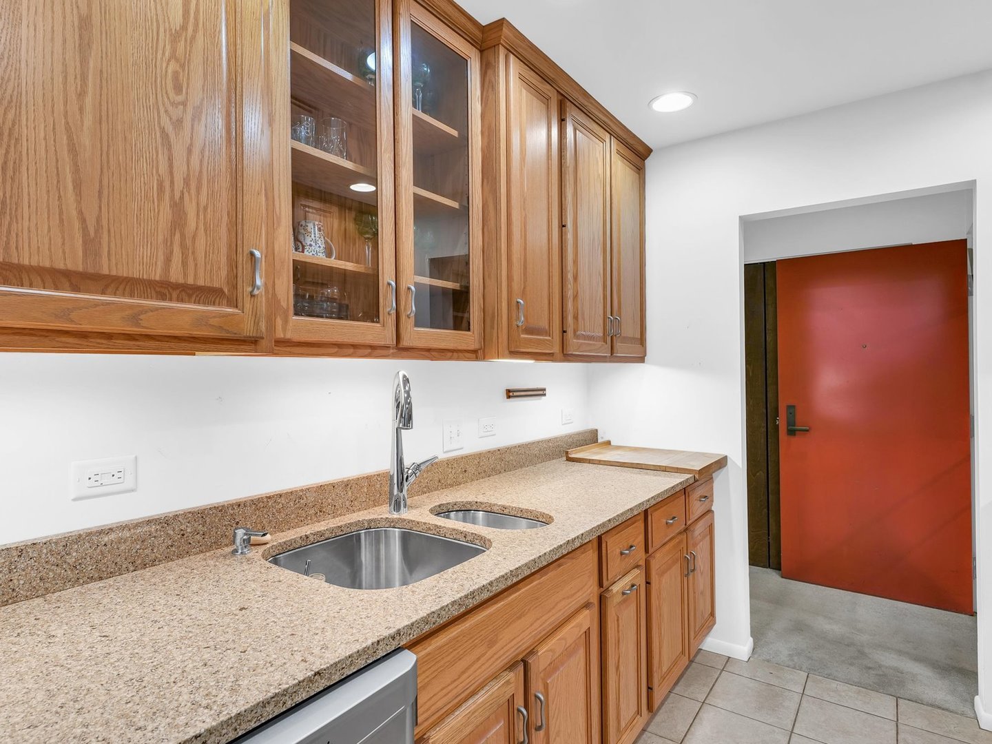 107 North Elm Street, Unit 310 Champaign, IL 61820 - Photo 13 of 34 a kitchen with a sink and cabinets