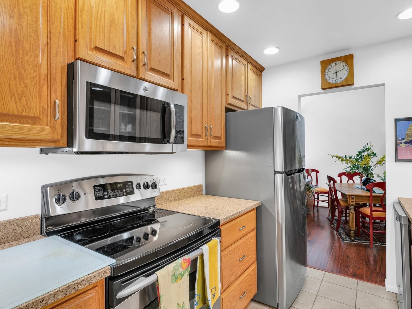 107 North Elm Street, Unit 310 Champaign, IL 61820 - Photo 15 of 34 a kitchen with stainless steel appliances a stove microwave and refrigerator
