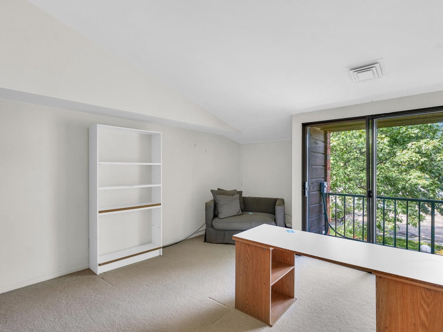107 North Elm Street, Unit 310 Champaign, IL 61820 - Photo 16 of 34 a living room with furniture and a large window