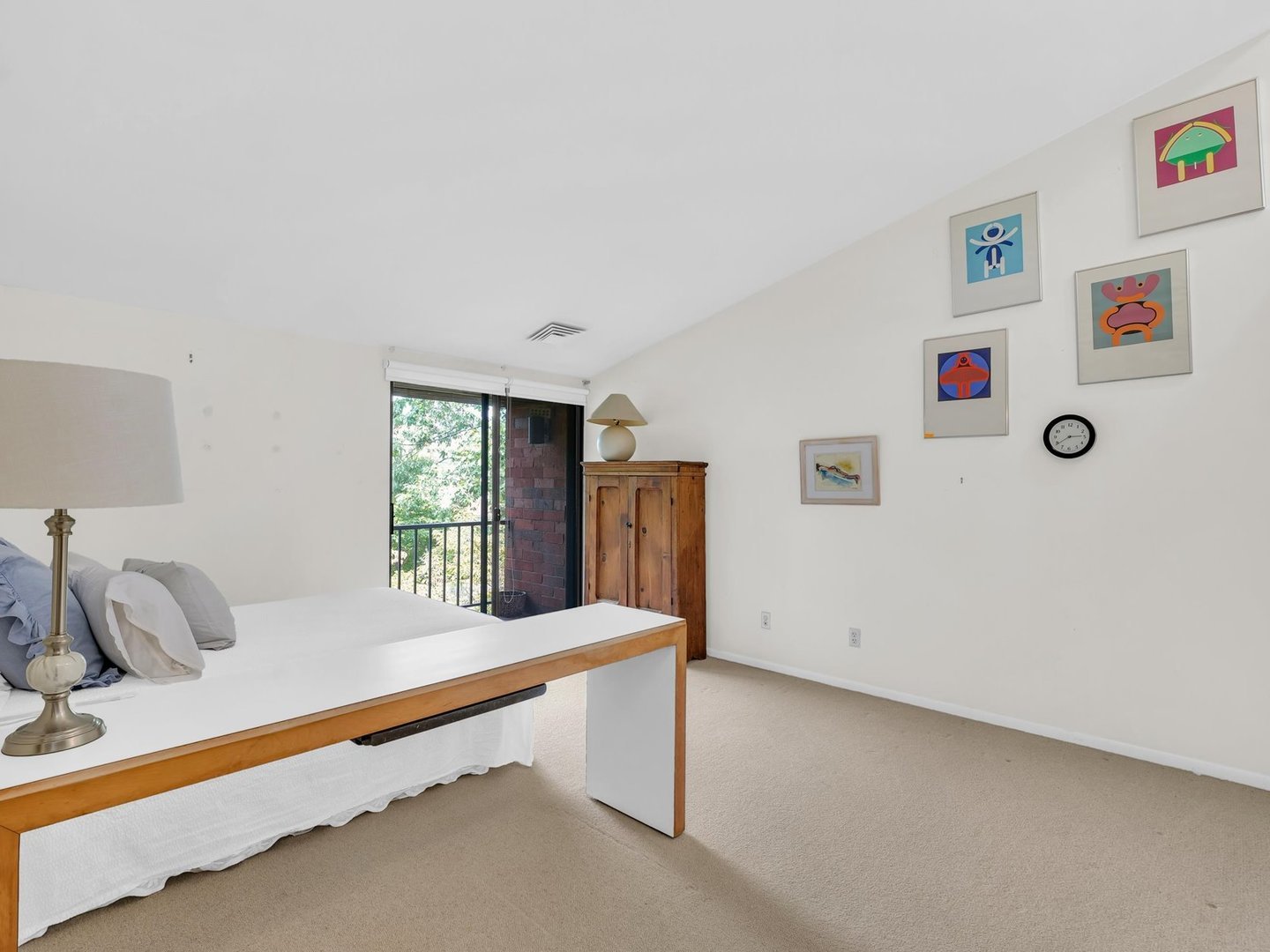 107 North Elm Street, Unit 310 Champaign, IL 61820 - Photo 19 of 34 a bedroom with furniture and a window