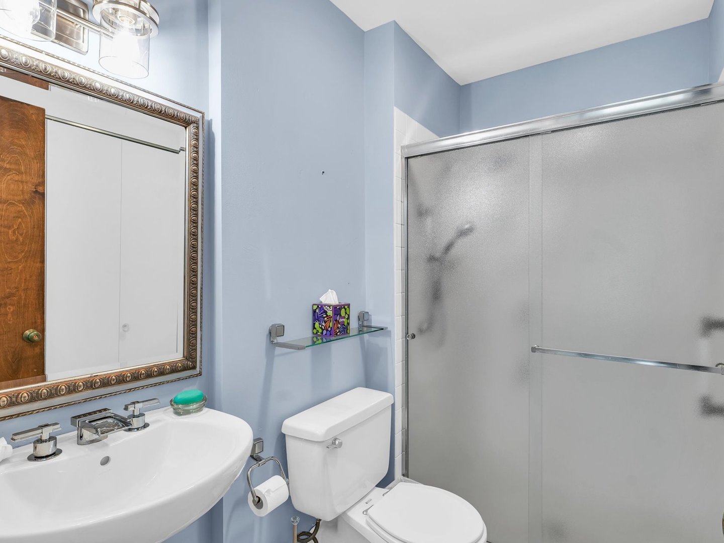 107 North Elm Street, Unit 310 Champaign, IL 61820 - Photo 24 of 34 a bathroom with a sink toilet and shower