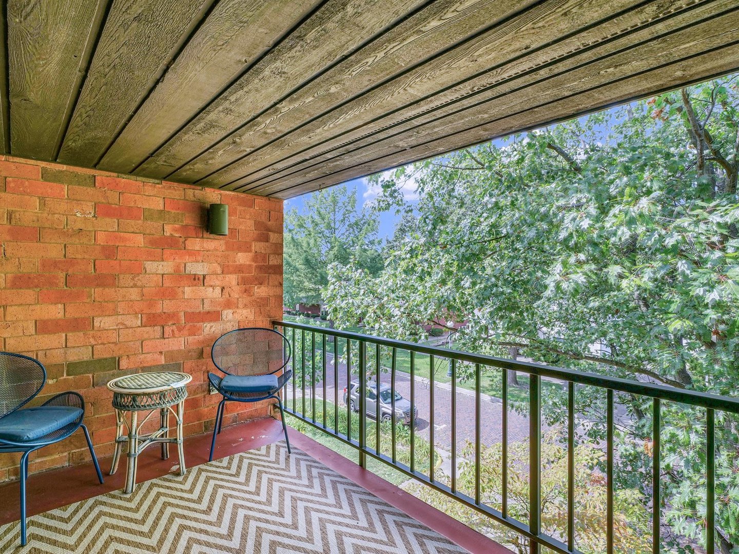 107 North Elm Street, Unit 310 Champaign, IL 61820 - Photo 26 of 34 a view of a chairs and table in the balcony