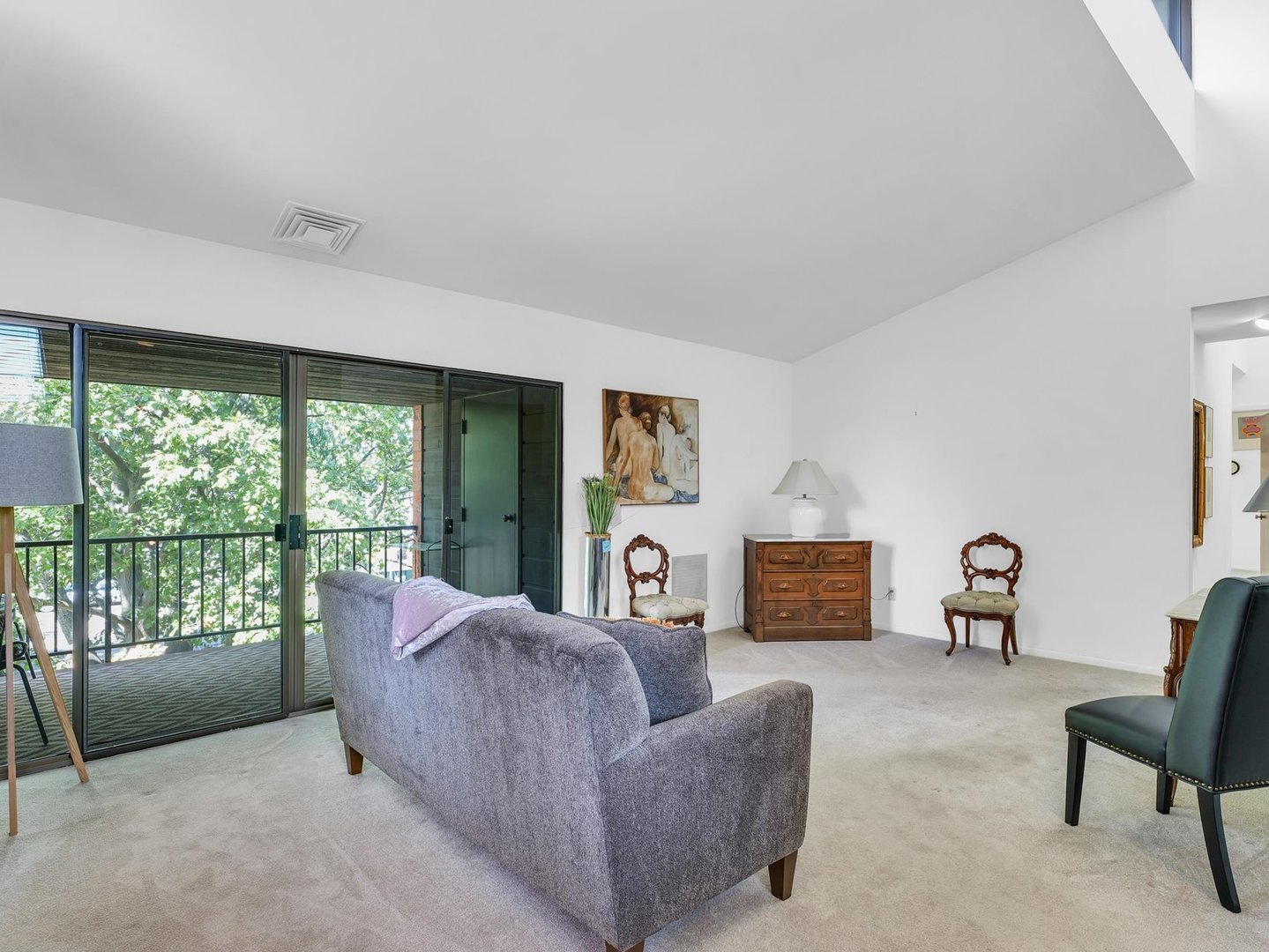 107 North Elm Street, Unit 310 Champaign, IL 61820 - Photo 8 of 34 a living room with furniture and a floor to ceiling window