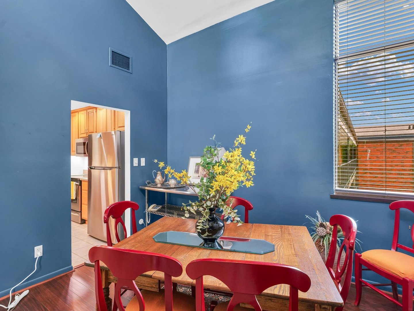 107 North Elm Street, Unit 310 Champaign, IL 61820 - Photo 9 of 34 a view of a dining room with furniture and a potted plant