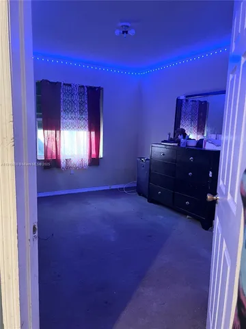 a room with furniture and a window