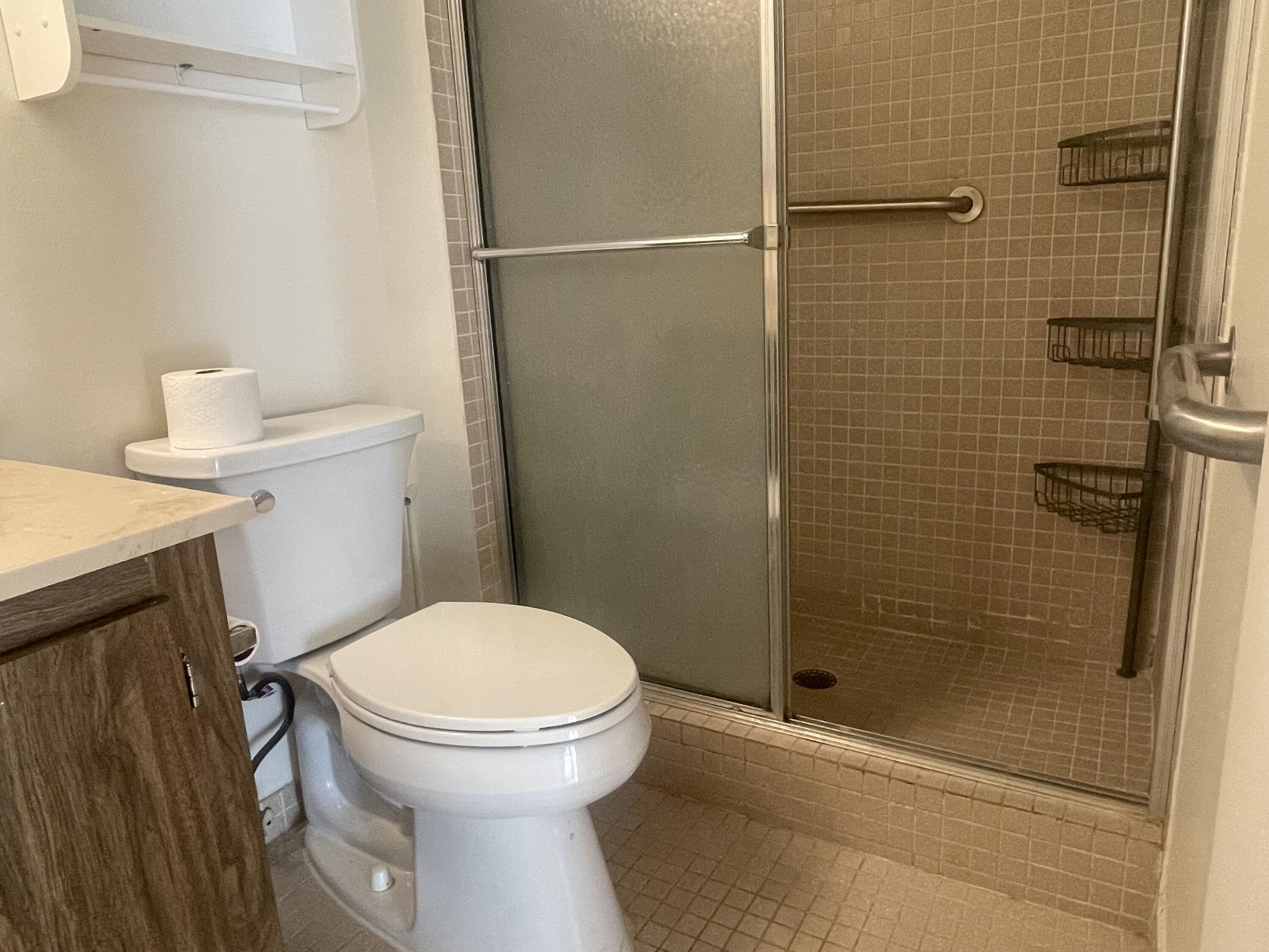 83 Capri B, Unit 83 Delray Beach, FL 33484 - Photo 11 of 26 a bathroom with a toilet and a shower