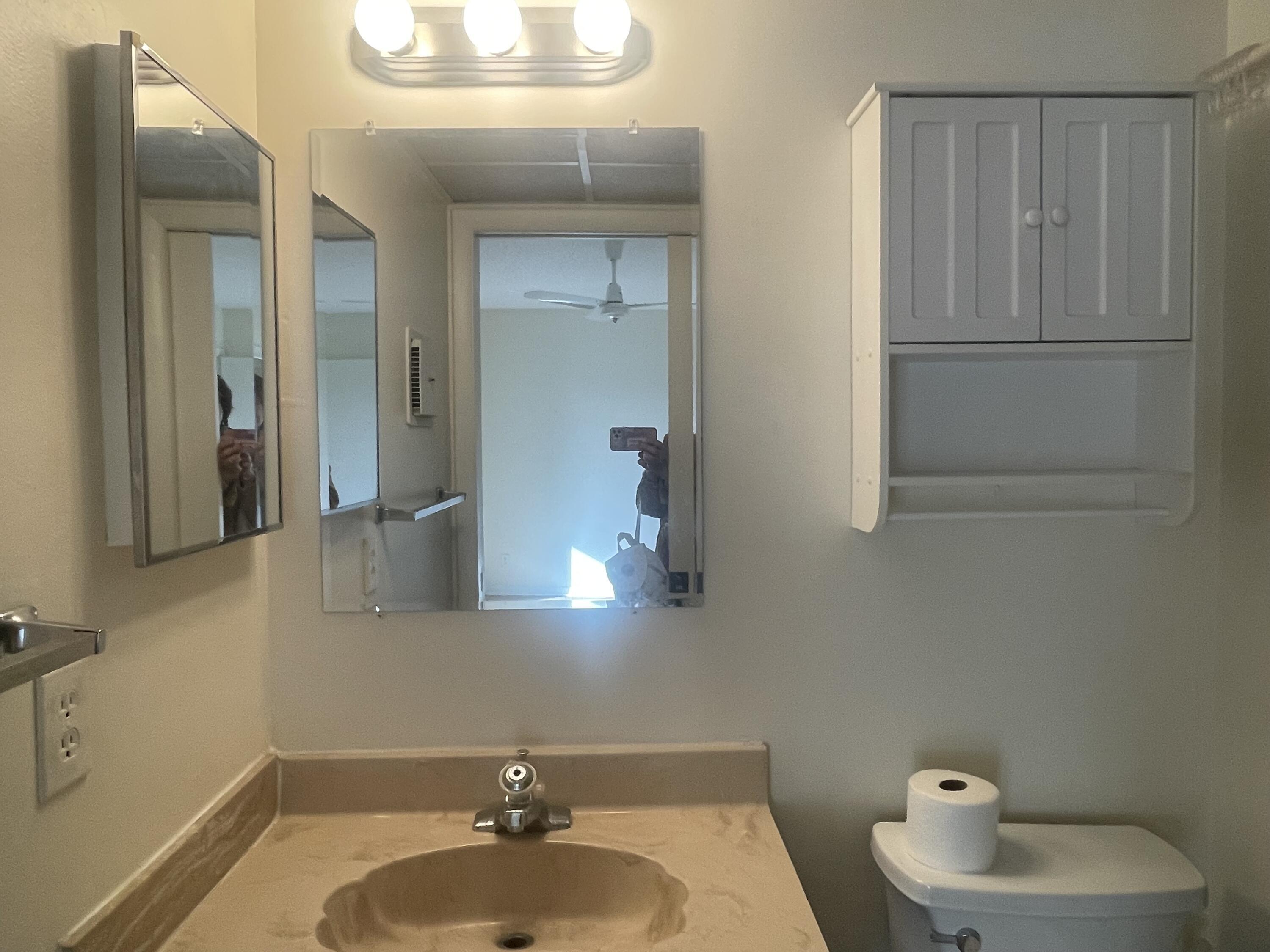 83 Capri B, Unit 83 Delray Beach, FL 33484 - Photo 12 of 26 a bathroom with a sink and a mirror