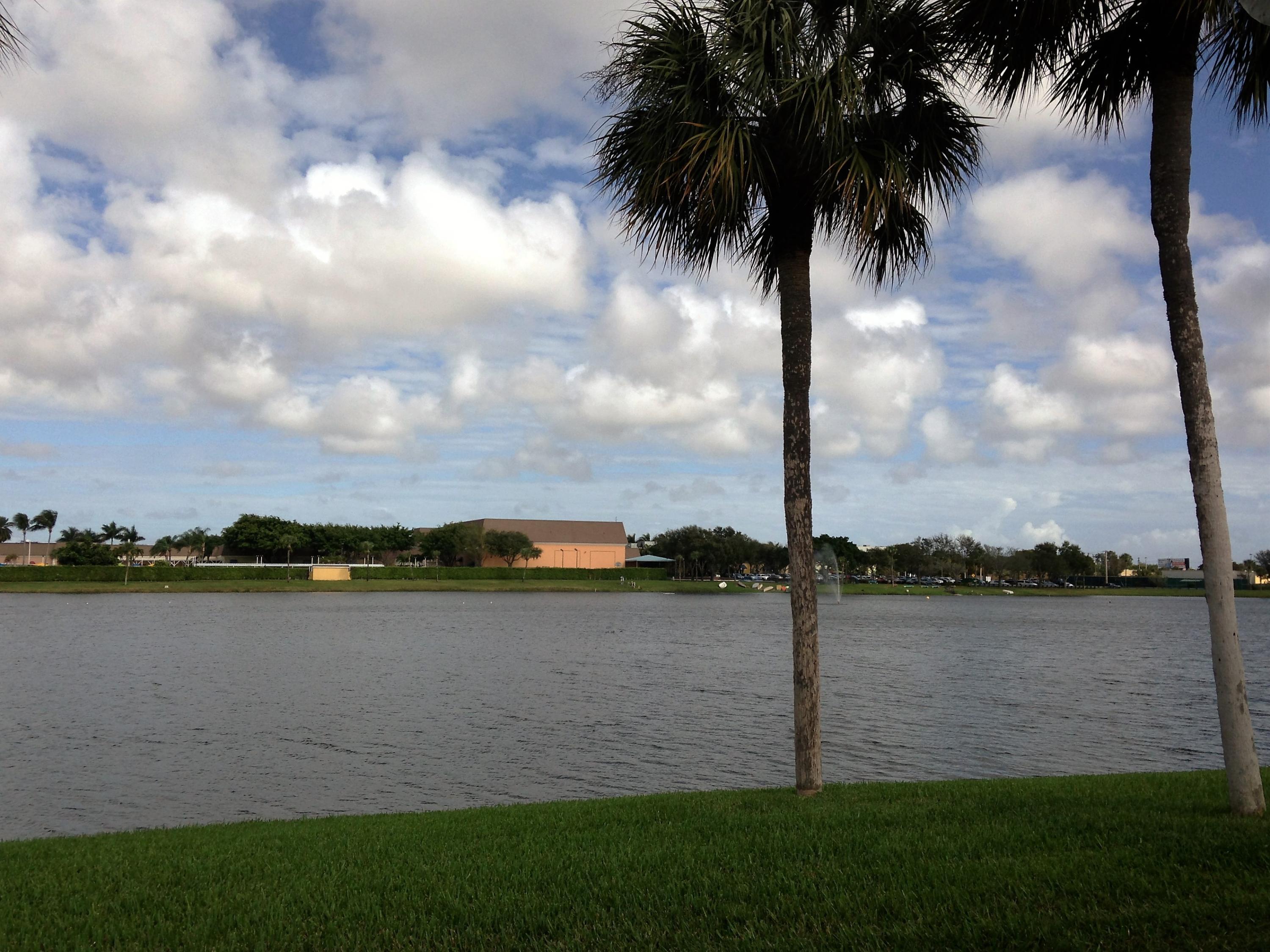 83 Capri B, Unit 83 Delray Beach, FL 33484 - Photo 22 of 26 a view of a lake with houses in the background