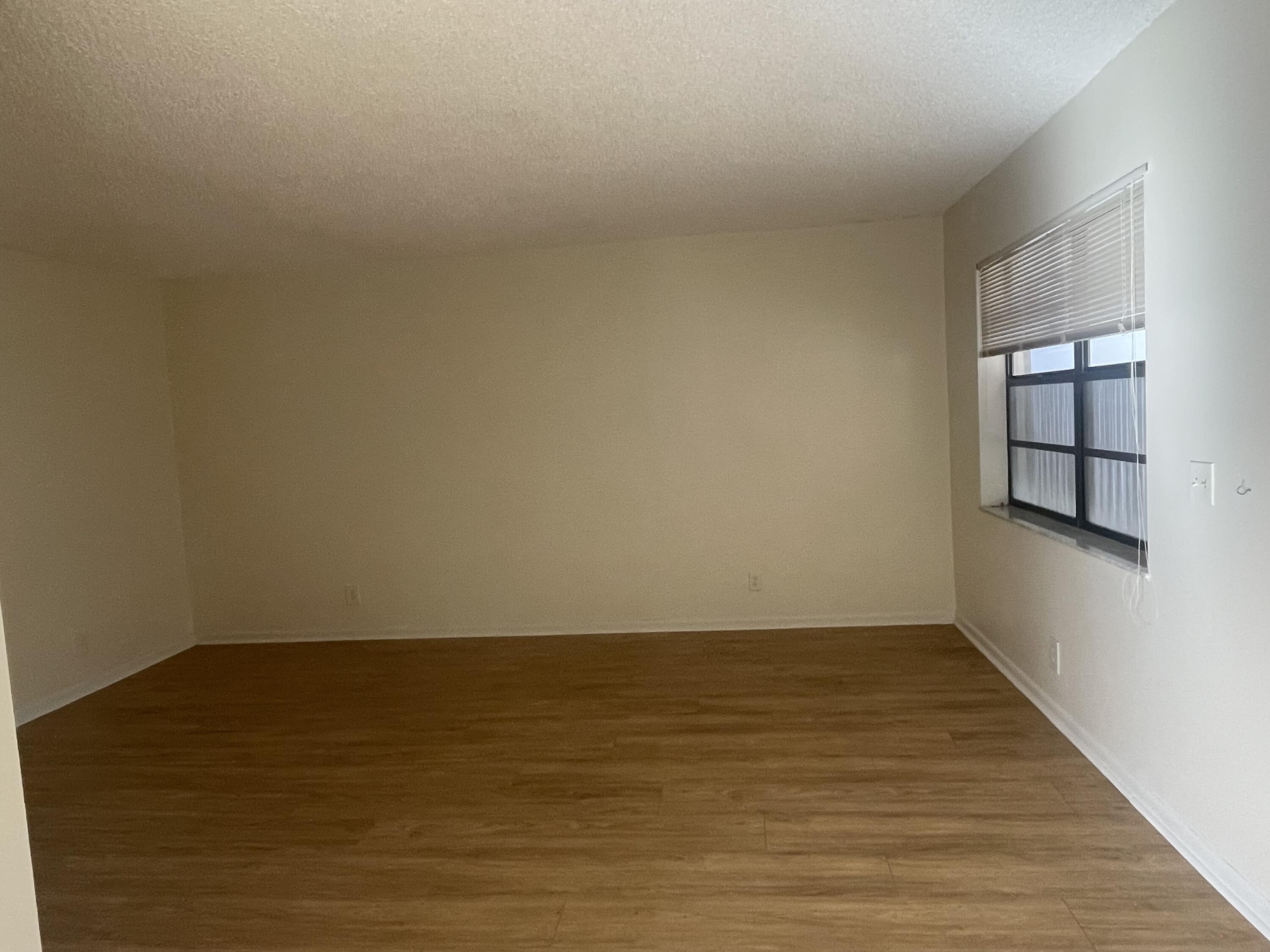83 Capri B, Unit 83 Delray Beach, FL 33484 - Photo 8 of 26 a view of an empty room and window
