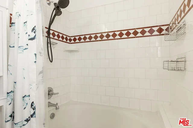 a bathroom with a shower and a bathtub