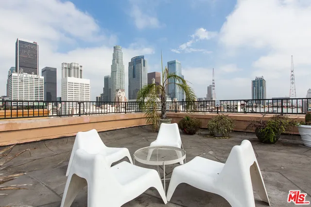a view of swimming pool with outdoor seating