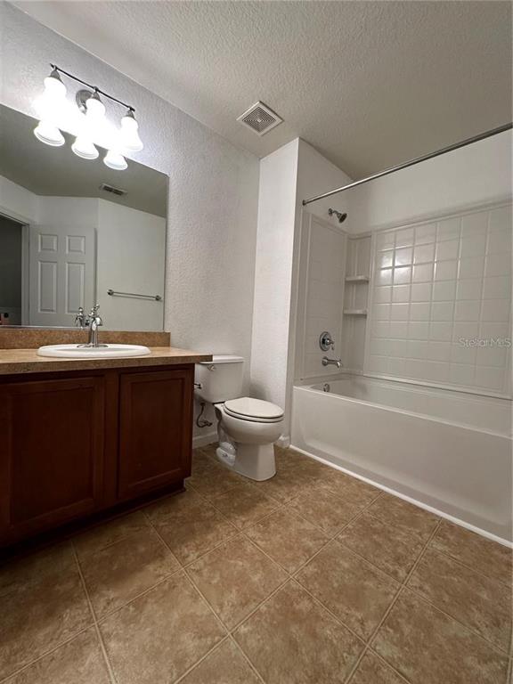 4500 Southwest 52nd Circle, Unit 106 Ocala, FL 34474 - Photo 23 of 30 a bathroom with a sink a toilet and shower