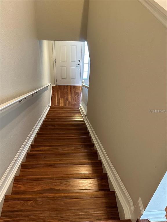 4500 Southwest 52nd Circle, Unit 106 Ocala, FL 34474 - Photo 26 of 30 a view of entryway and wooden floor