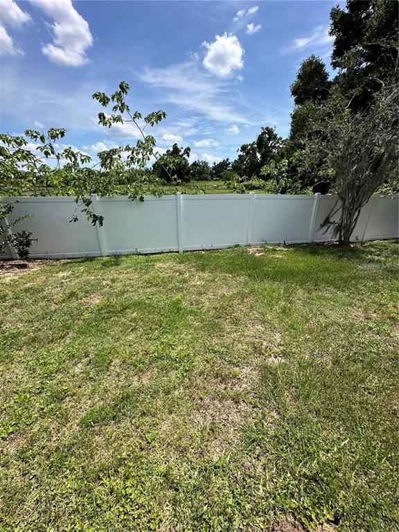 4500 Southwest 52nd Circle, Unit 106 Ocala, FL 34474 - Photo 30 of 30 a view of outdoor space and yard