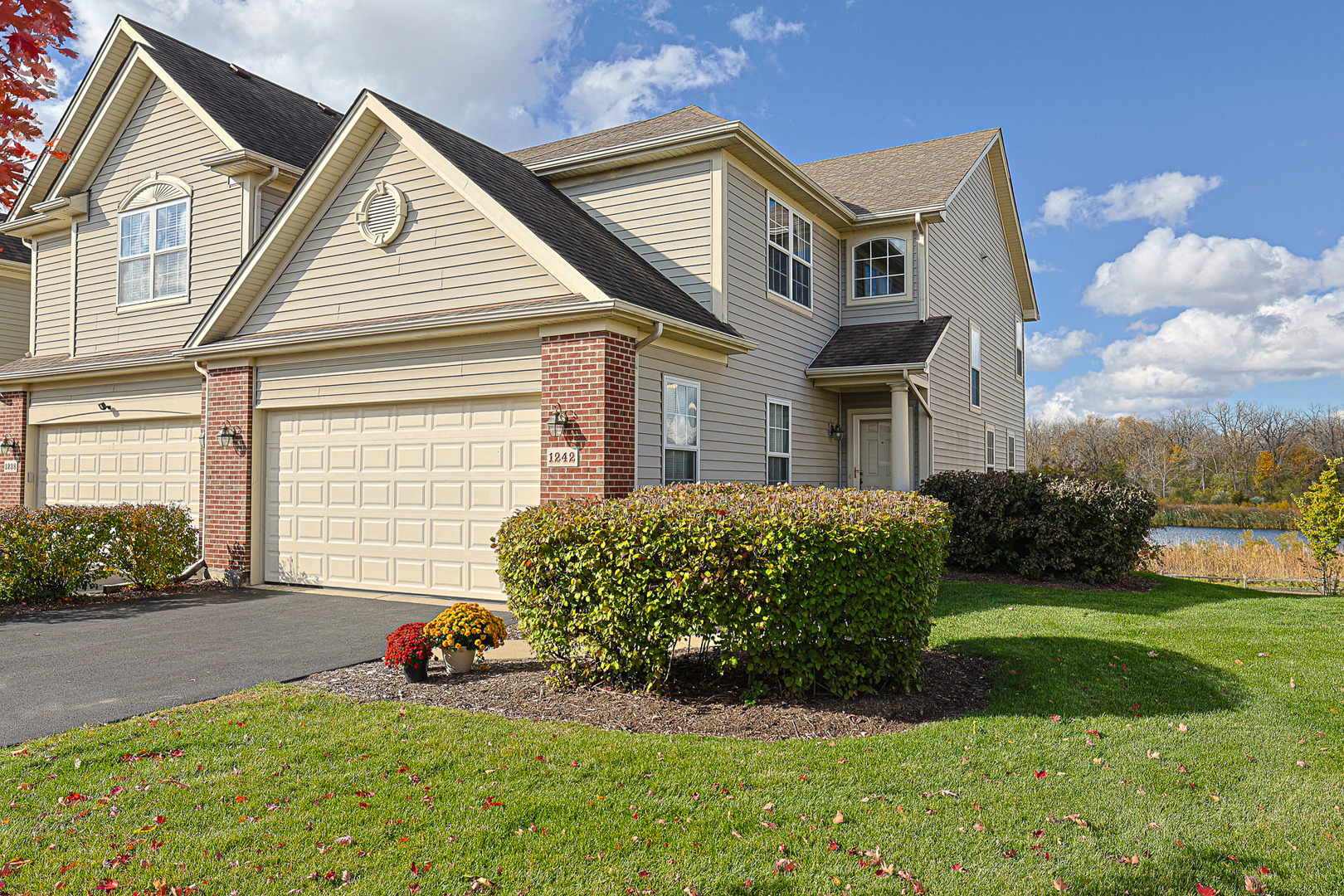 a front view of a house with garden