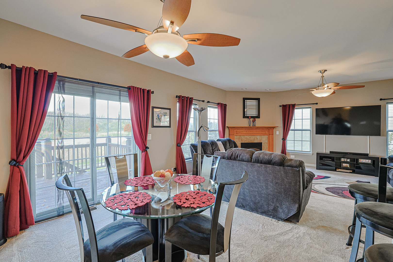 1242 Prairie View Parkway Cary, IL 60013 - Photo 12 of 36 a living room with furniture a flat screen tv and a large window