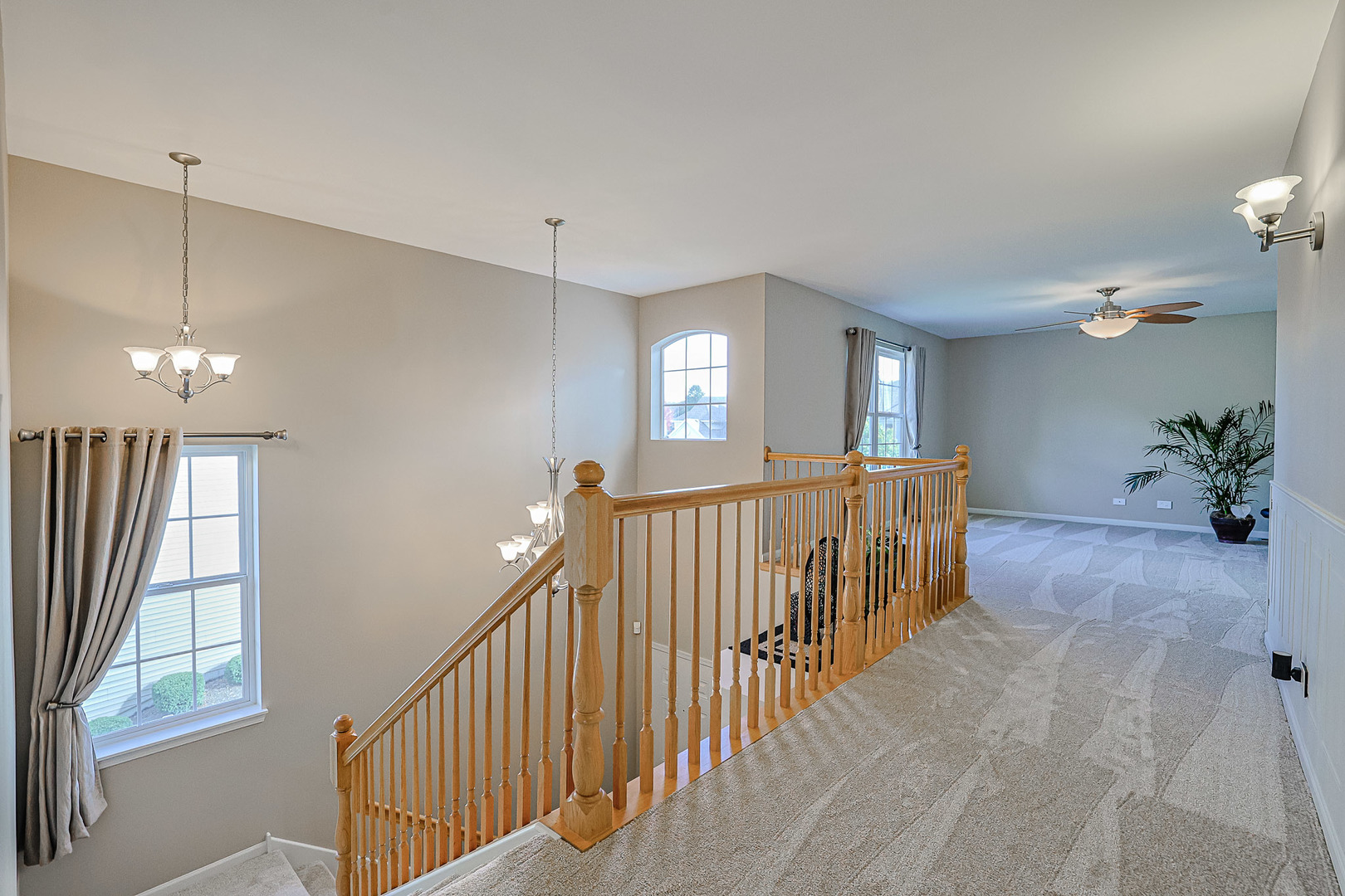 1242 Prairie View Parkway Cary, IL 60013 - Photo 18 of 36 a view of a hallway with a chandelier