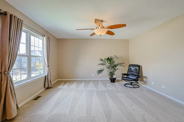a view of room with a window and wooden floor