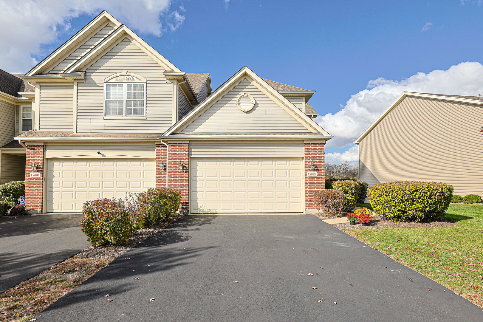 1242 Prairie View Parkway Cary, IL 60013 - Photo 2 of 36 a view of a house with a yard and garage